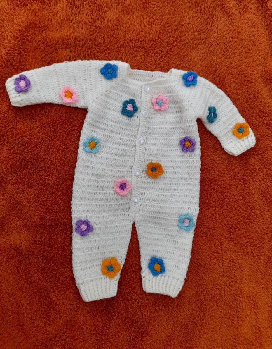 Crochet baby floral romper in white with multicolour flowers