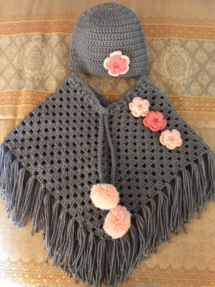 Handmade crochet baby poncho and cap set