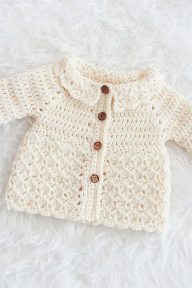 Crochet baby buttoned cardigan in pink and off white