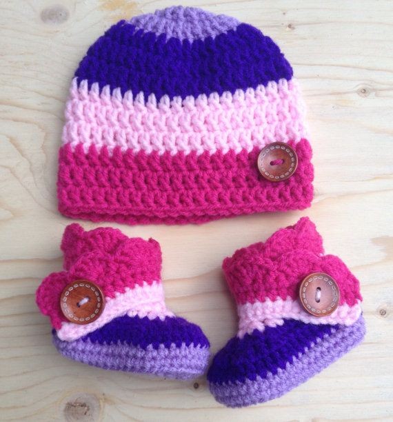 Crochet baby cap and booties set in pink and purple stripes with wooden buttons