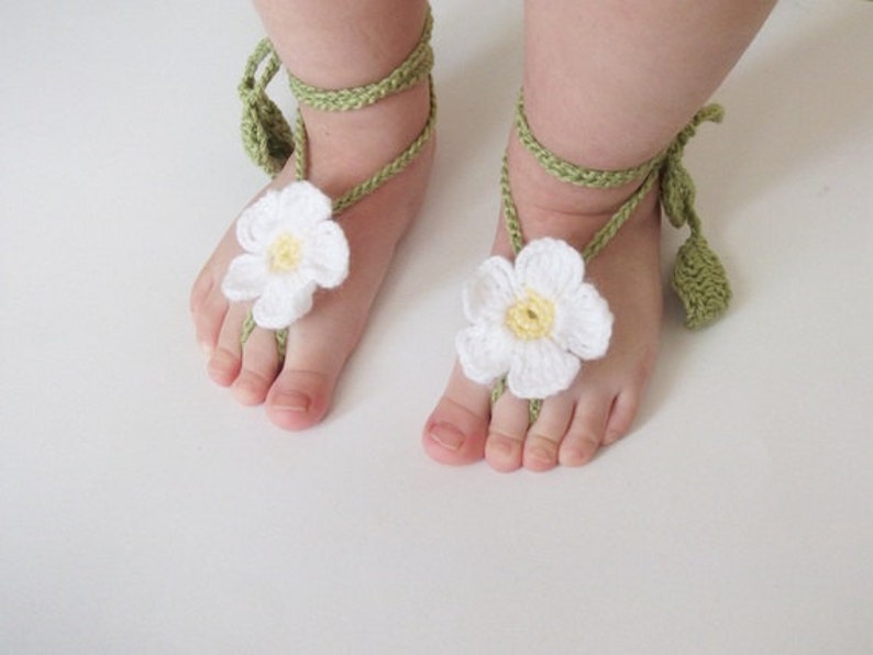 White crochet barefoot baby flower sandals with green vine straps
