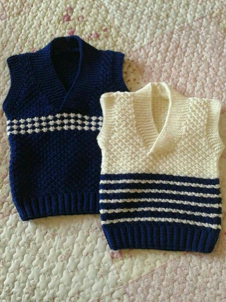 Handmade crochet baby boy sweater vest in navy blue and cream with stripe detail