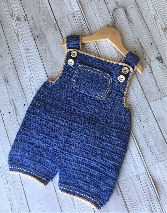 Handmade crochet baby denim style short dungaree in blue with pocket detail