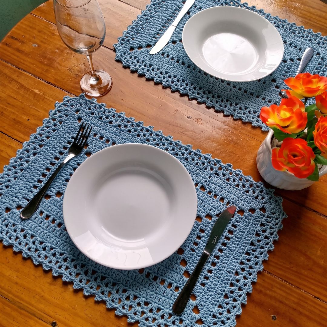 Set of 6 crochet chic placemats laid out on a dining table
