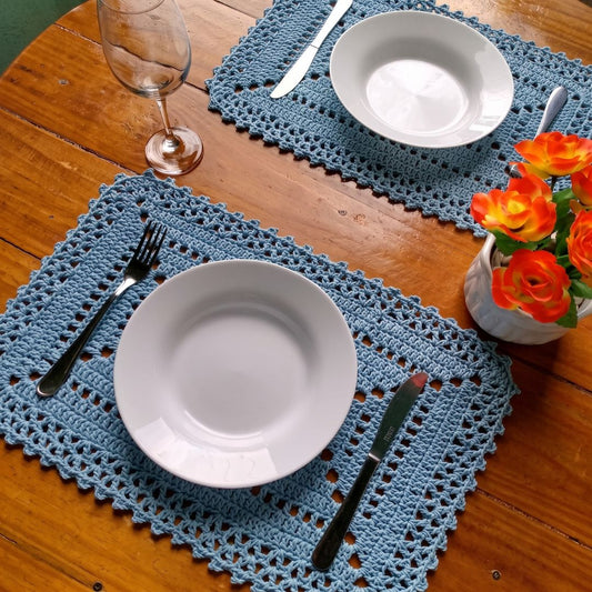 Set of 6 crochet chic placemats laid out on a dining table