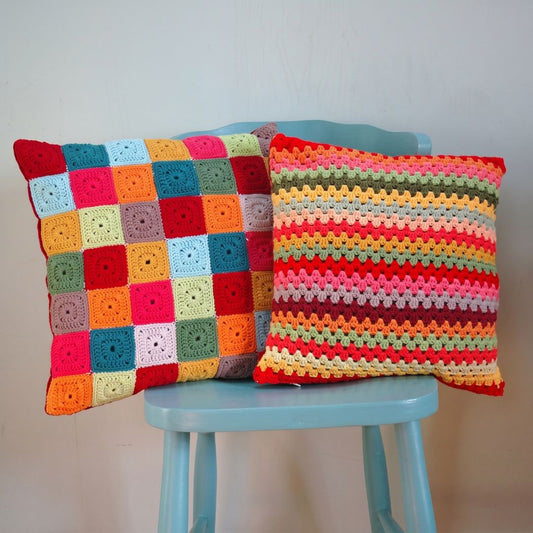 Crochet cushion cover in a colorful, multi-color design