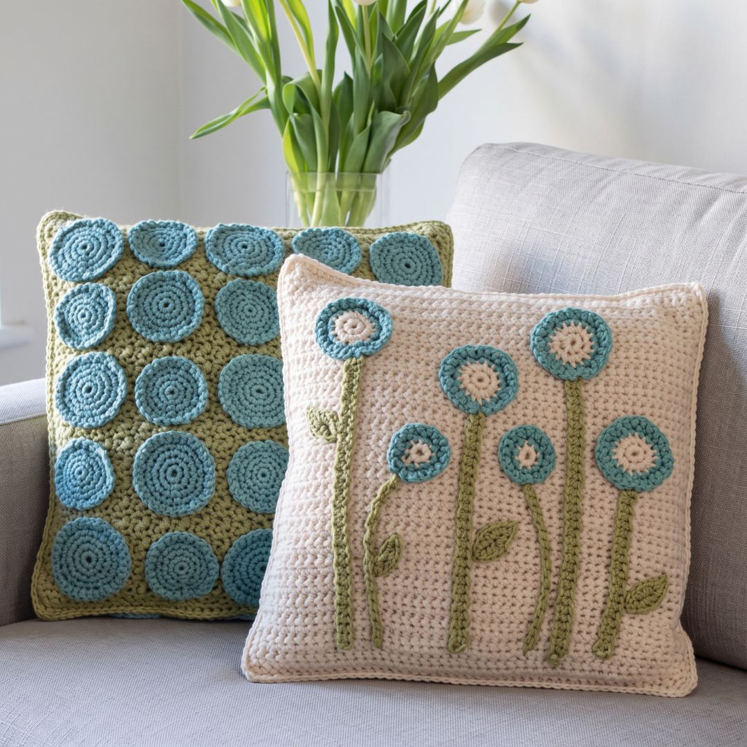 Crochet cushion cover with a plant-inspired pattern