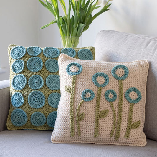 Crochet cushion cover with a plant-inspired pattern