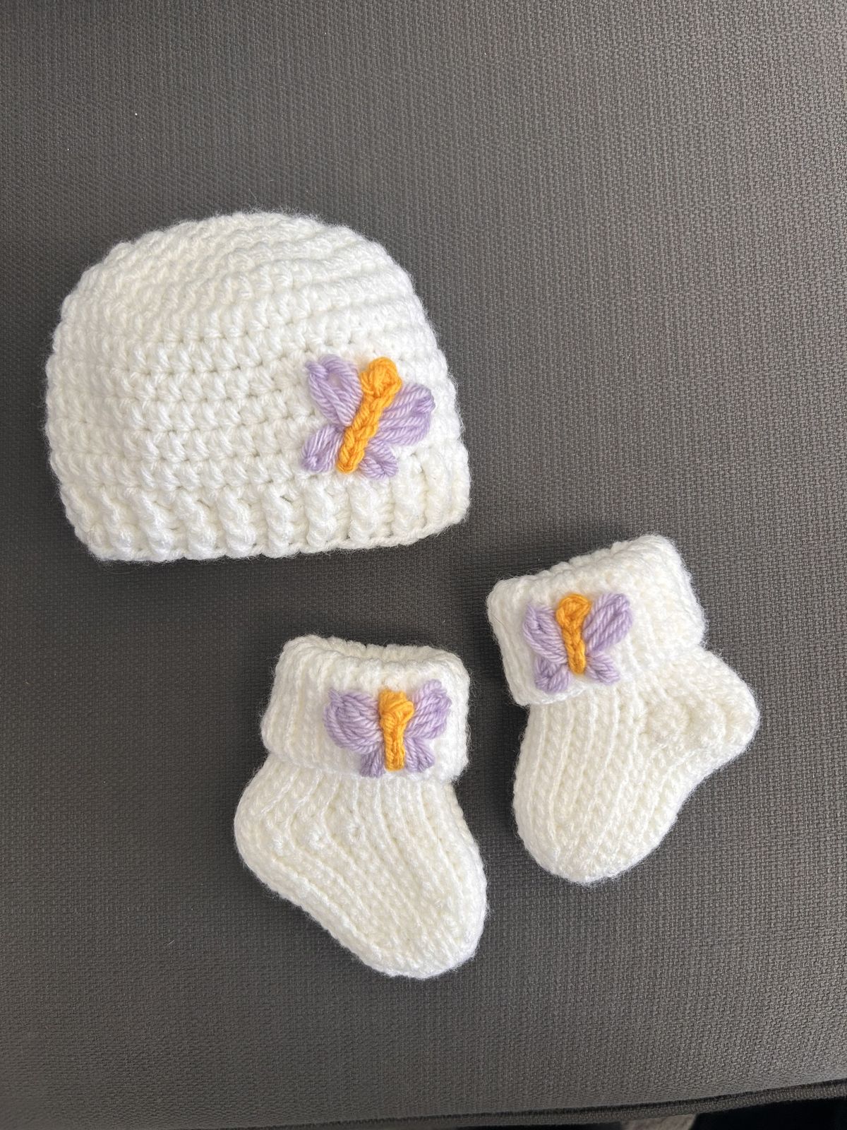 Handmade crochet baby butterfly cap and booties set