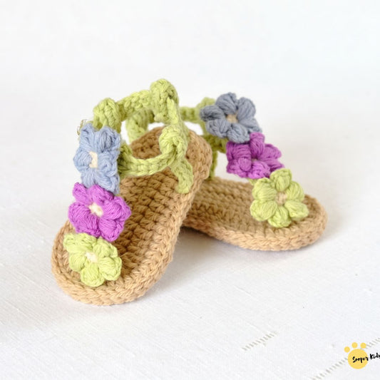 Tan crochet baby garden flower sandals with purple, blue and green flowers