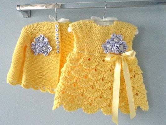 Crochet baby girl dress and cardigan set in yellow