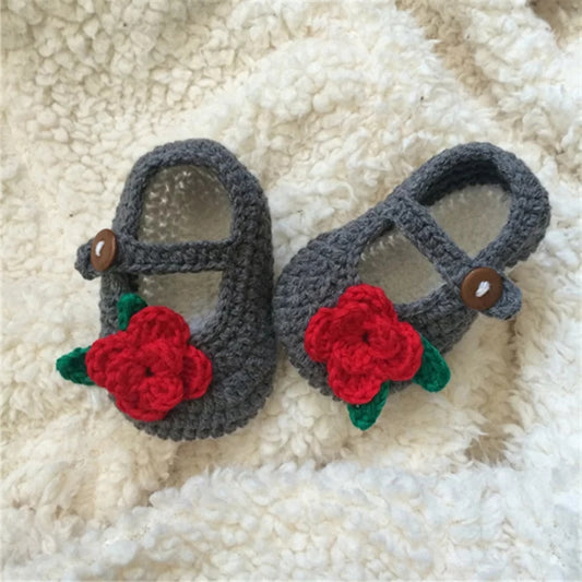 Grey crochet baby shoes with red roses