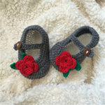 Grey crochet baby shoes with red roses