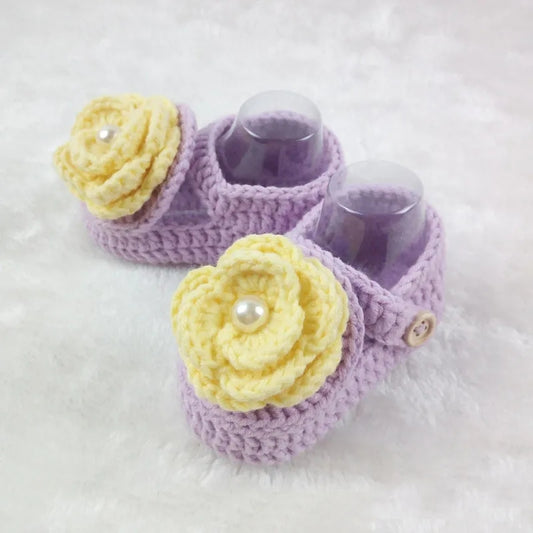 Lavender crochet baby shoes with yellow rose