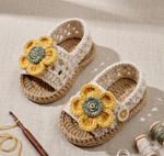 Handmade crochet baby girl sunflower sandals in beige with yellow flower detail