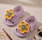 Handmade crochet baby girl sunflower sandals in lilac with yellow flower detail