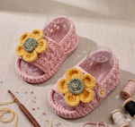 Handmade crochet baby girl sunflower sandals in pink with yellow flower detail