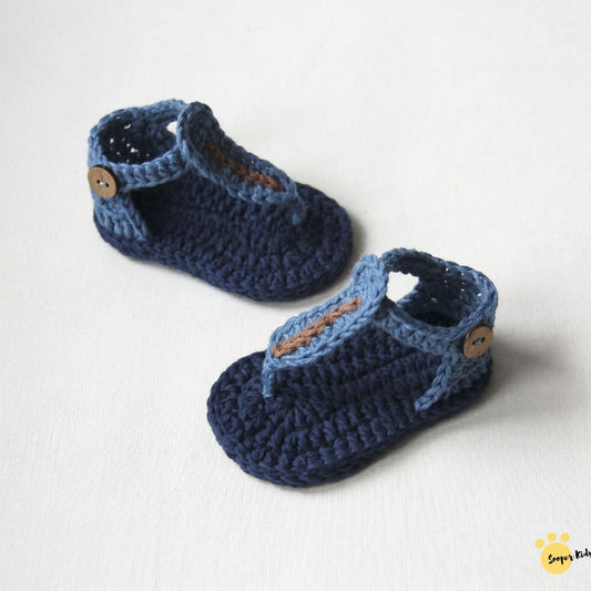 Handmade crochet baby t-strap sandals in blue with wooden button detail