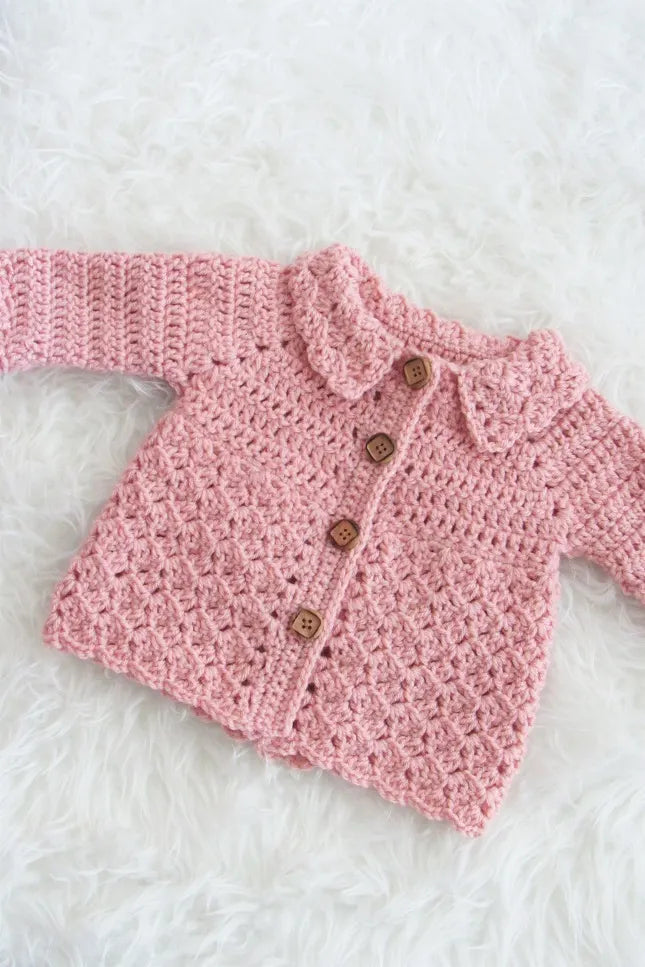 Crochet baby buttoned cardigan in pink and off white