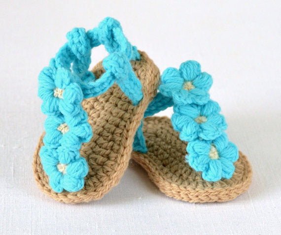 Tan crochet baby sandals with turquoise flowers