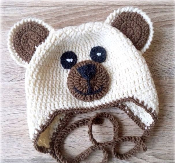 Crochet baby bear cap in cream with bear ears