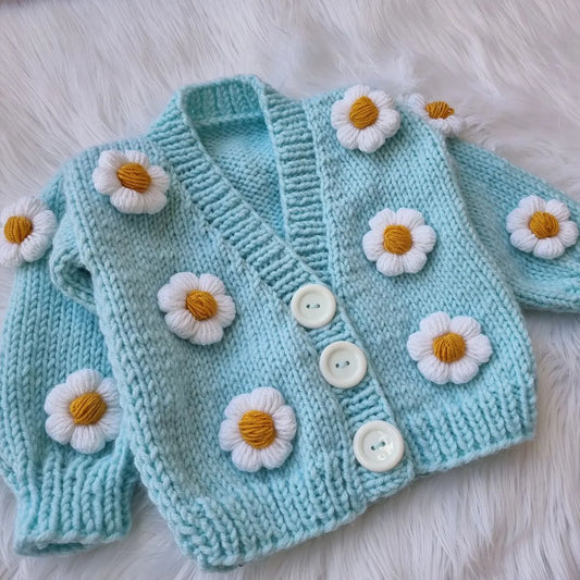 Crochet baby girl blue cardigan with white daisy flowers