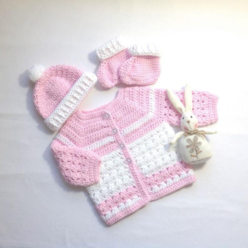 Crochet baby girl pink and white cardigan with matching cap and booties