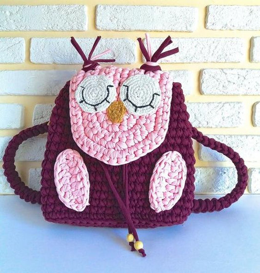 Crochet baby owl backpack in maroon with sleepy owl face