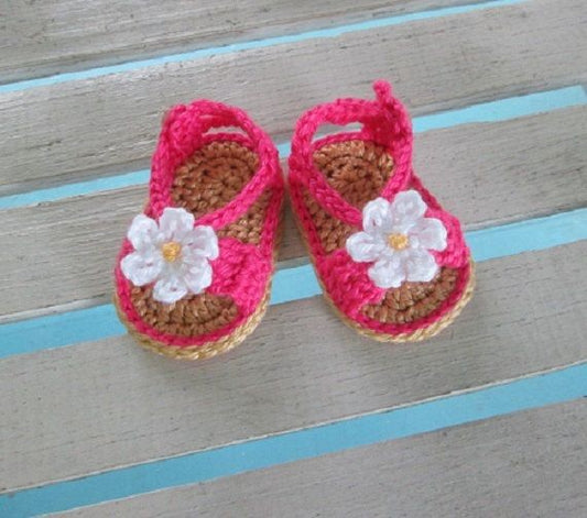 Pink crochet baby sandals with white daisy