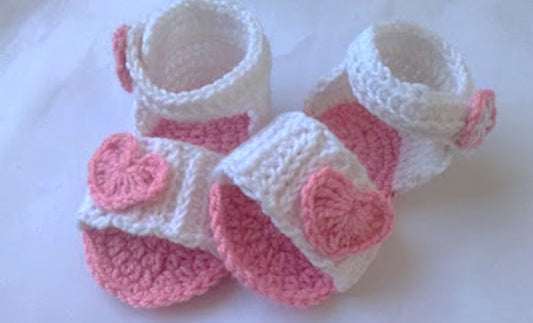 White crochet baby sandals with pink hearts