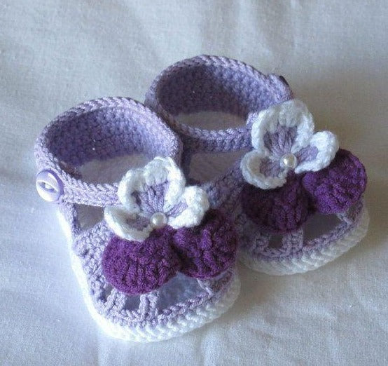 Lavender crochet baby sandals with purple flower
