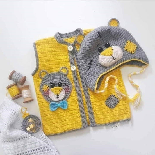 Handmade crochet baby yellow vest with 3D bear face appliqué and matching grey bear ear hat with tassel ties