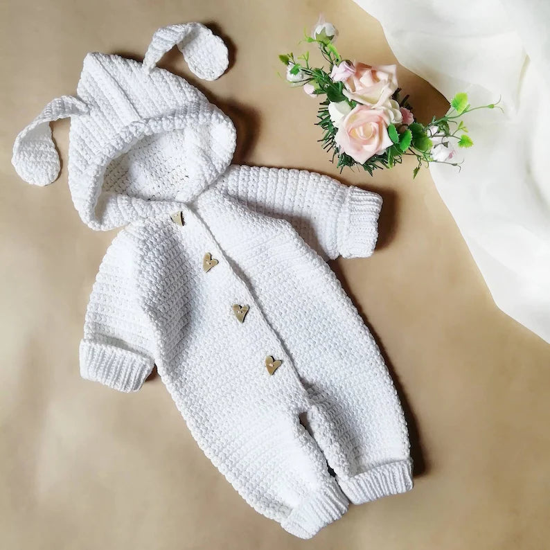 Handmade crochet baby bunny hooded romper in white with heart button detail