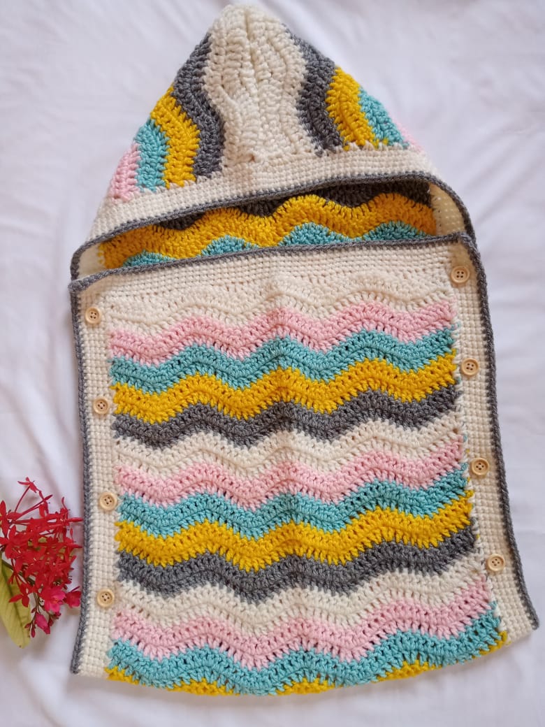 Handmade crochet baby chevron cocoon in multicolor pastel stripes with wooden button detail