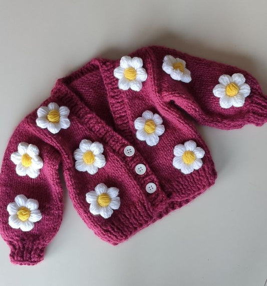 Handmade crochet baby girl pink cardigan with white and yellow daisy flower appliques