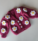 Handmade crochet baby girl pink cardigan with white and yellow daisy flower appliques