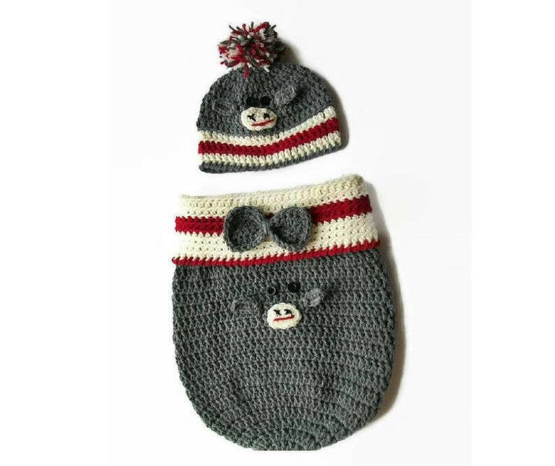 Handmade crochet baby monkey cocoon set in grey and red with pom pom hat and bow tie detail