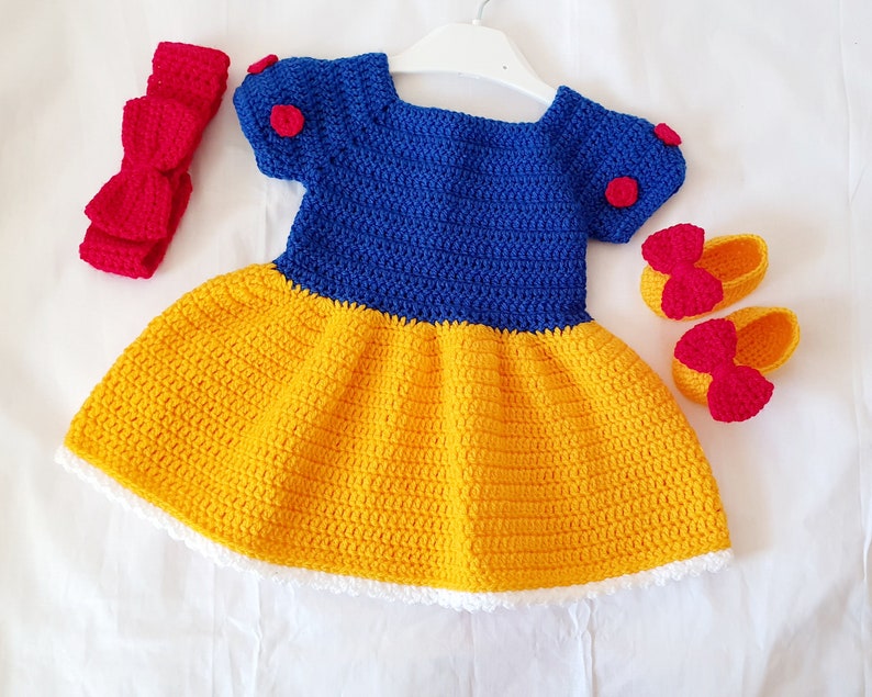 Handmade crochet baby girl dress set with headband and booties in blue and yellow